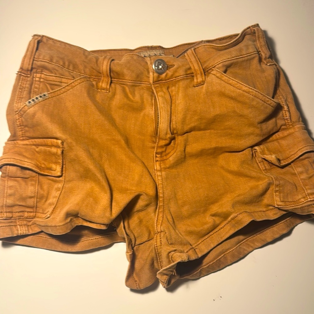 rusty orange colored cargo jean shorts